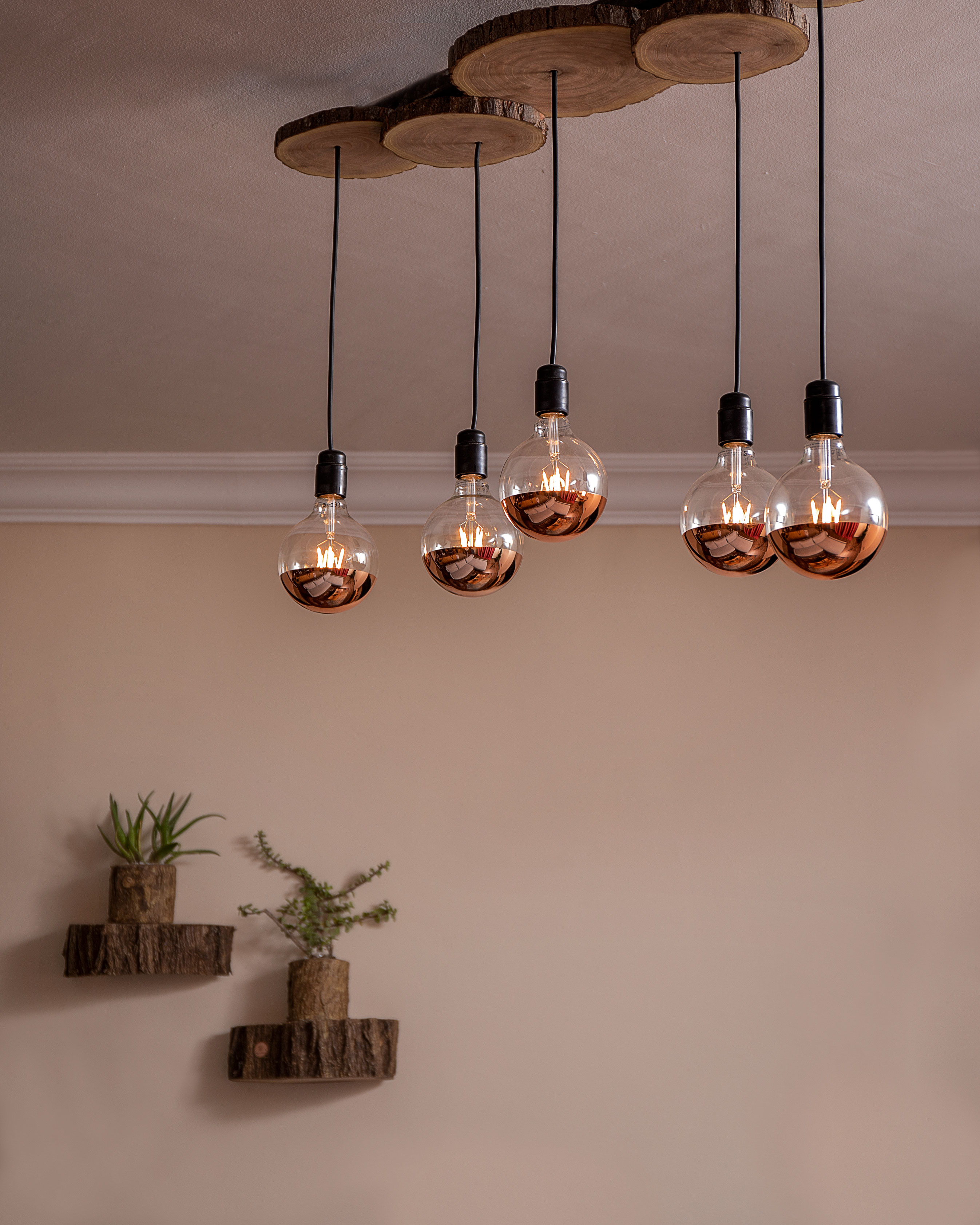 Crafted lighting detail suspended with handmade structure